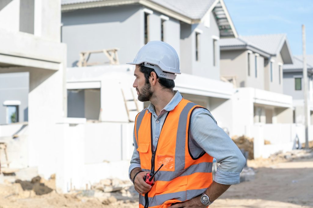 Construction worker are checking the construction progress of the housing project.